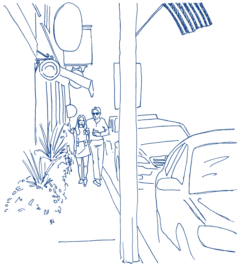 Couple walking along the sidewalk